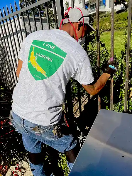 Crew worker sending metal fence